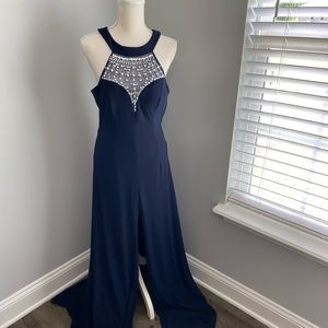 Elegant blue gown front slit with beads around the neckline. Smoke free home